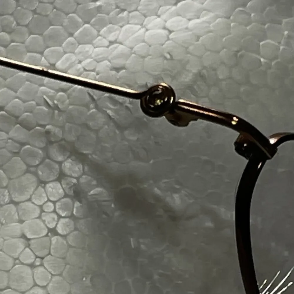 Adrienne Vittadini Eyeglasses Womens Titanium Oval Rose Gold Lightweight Frame